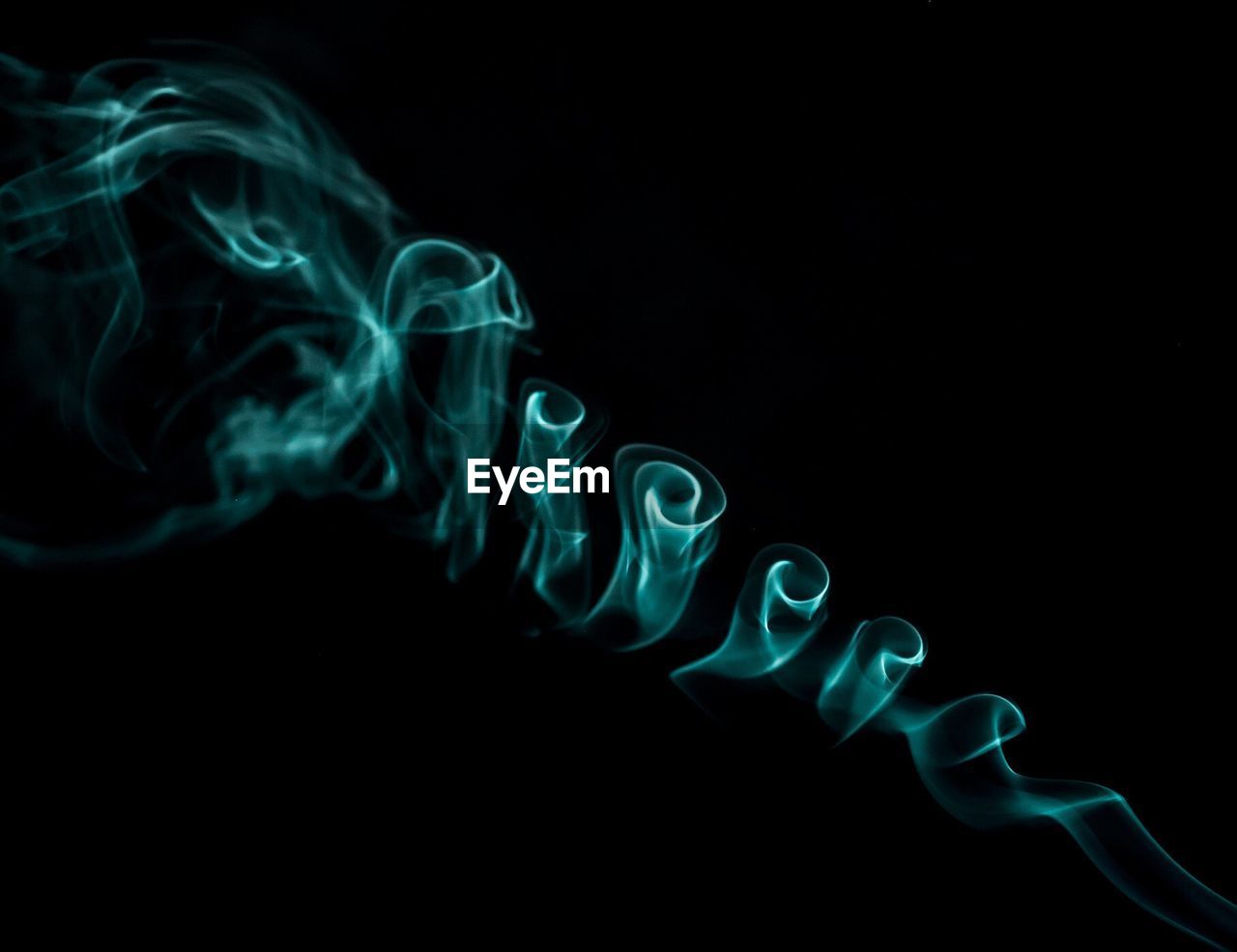 Close-up of smoke against black background