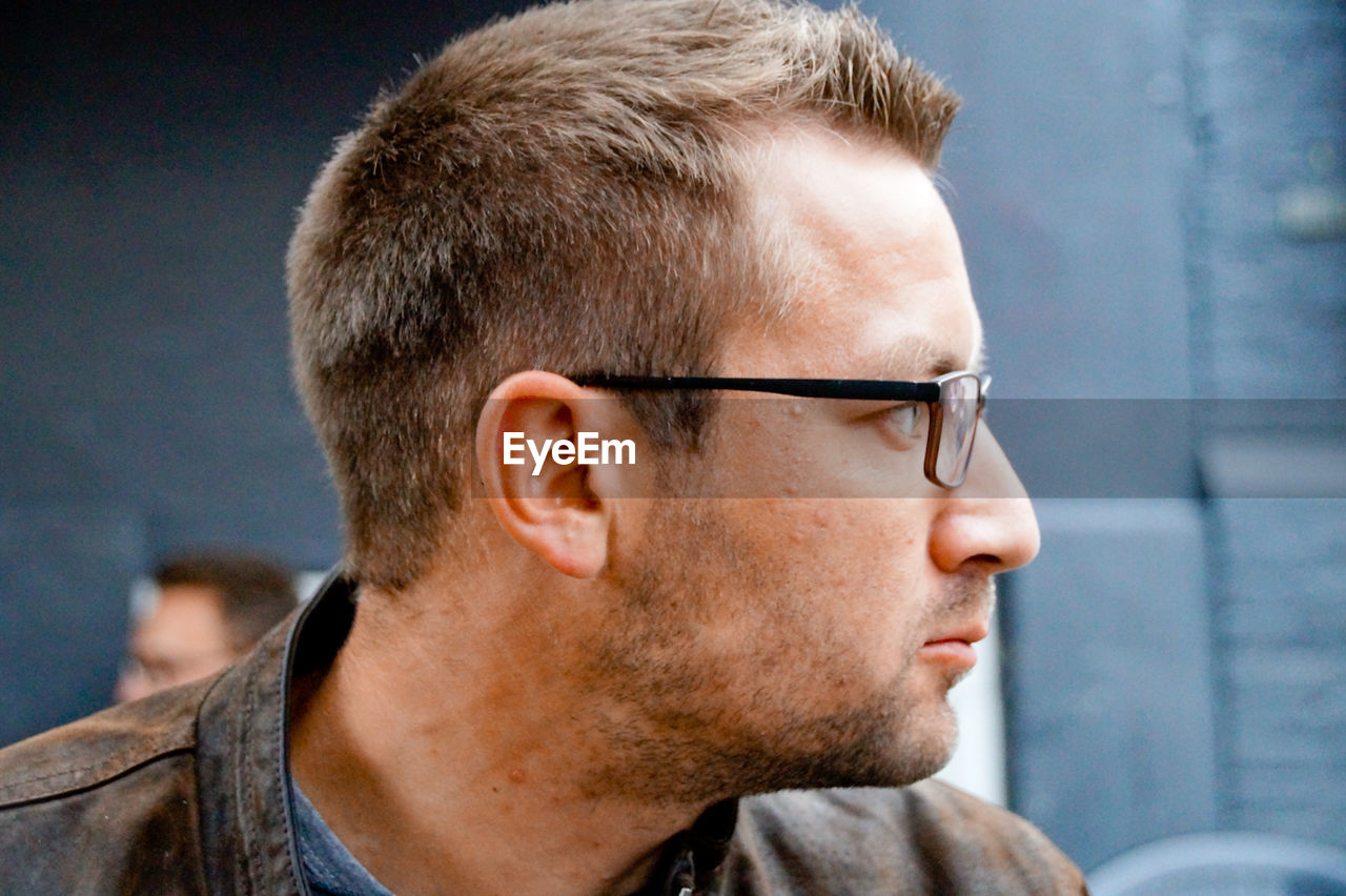 Close-up of man wearing eyeglasses outdoors