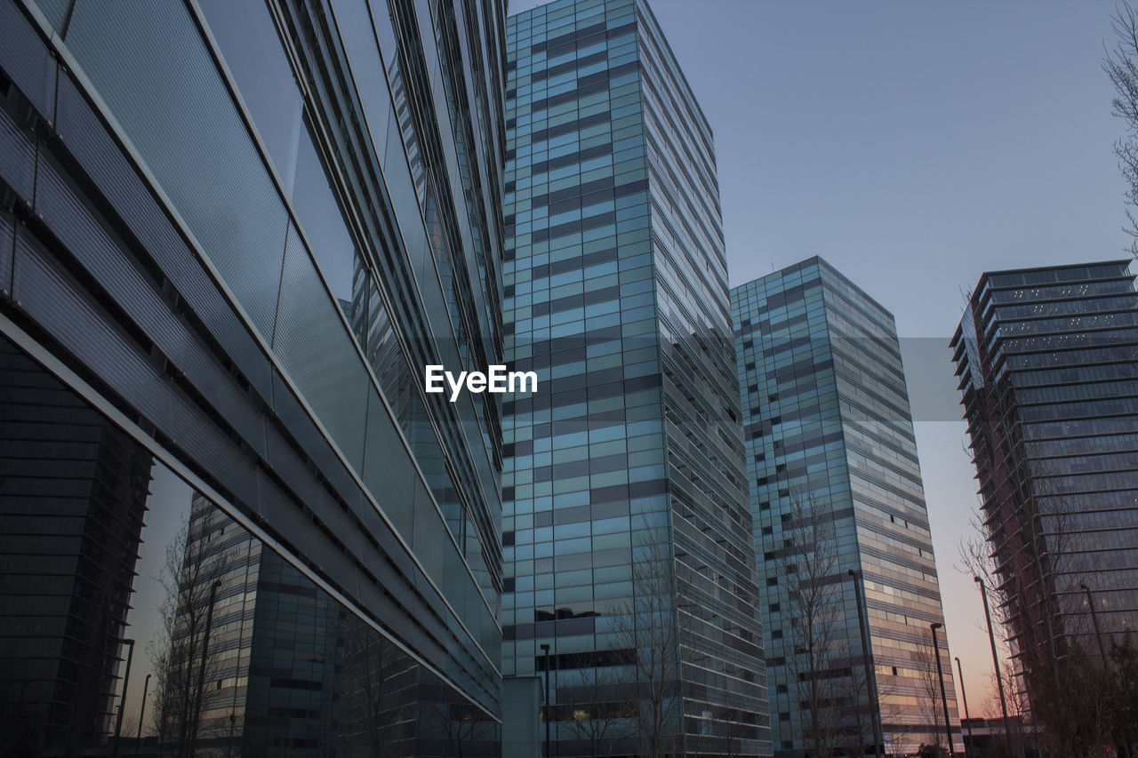 Low angle view of modern buildings against clear sky