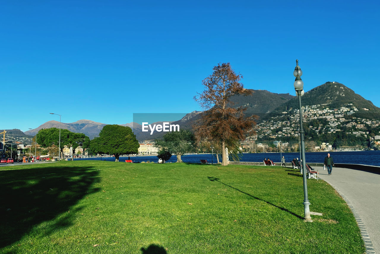 SCENIC VIEW OF LANDSCAPE AGAINST BLUE SKY