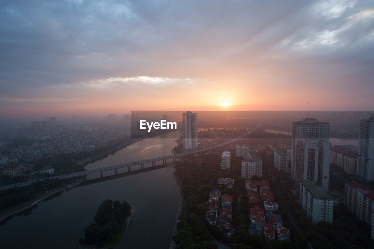 Aerial view of city at sunset