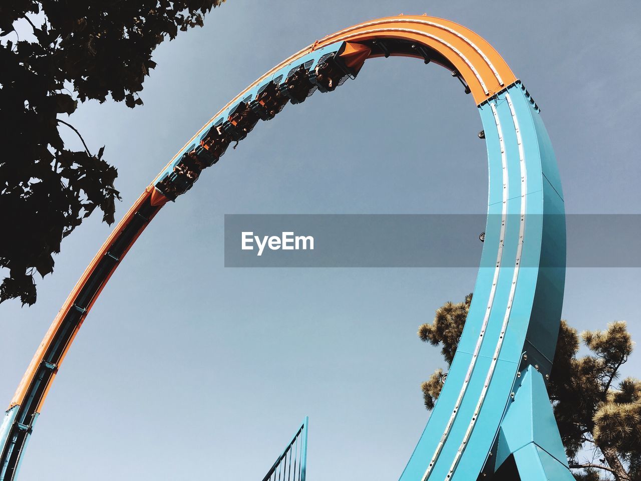 Low angle view of rollercoaster against sky