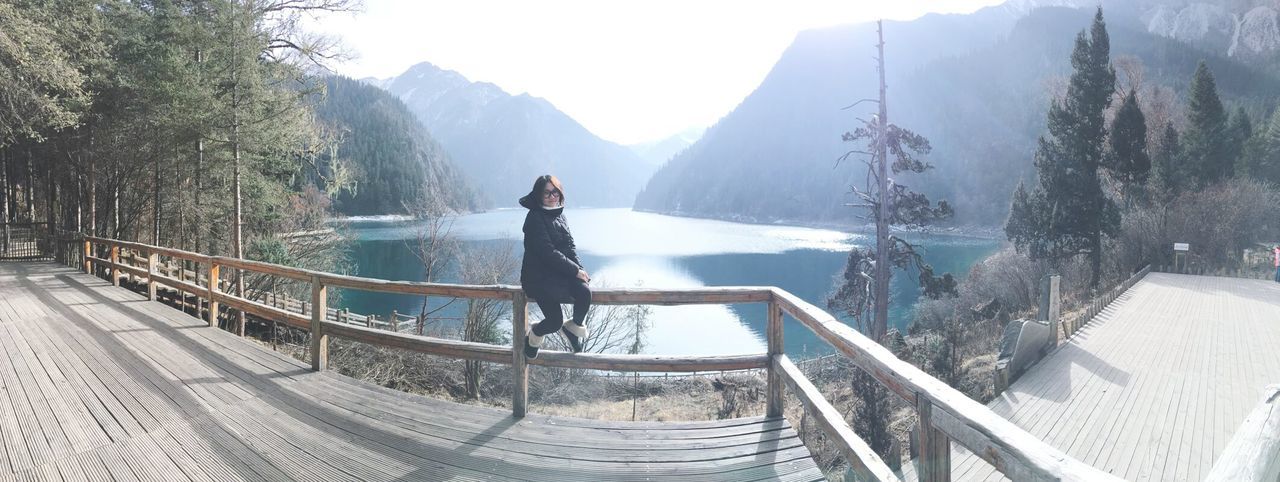 PANORAMIC VIEW OF WOMAN ON MOUNTAIN