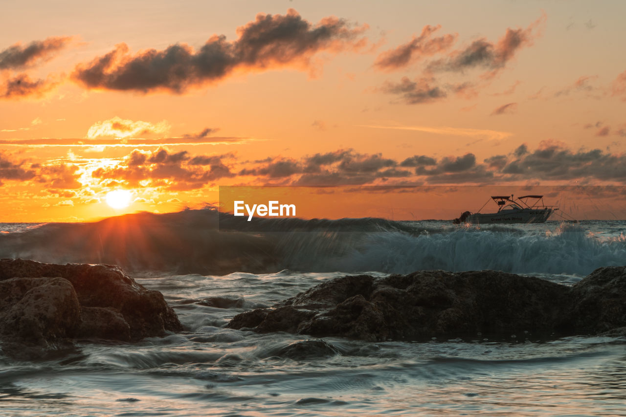 Scenic view of sea against sky during sunset