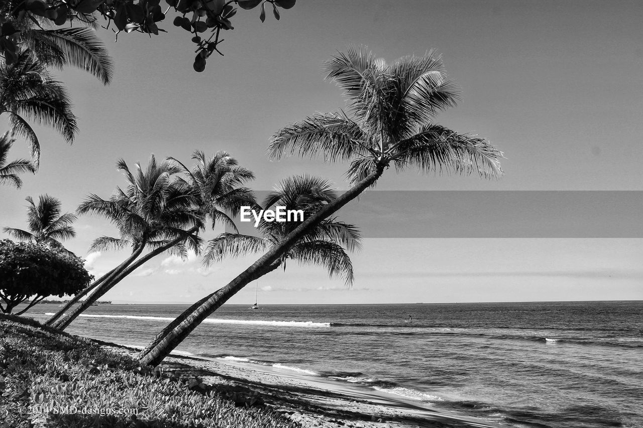 Scenic view of calm sea against blue sky