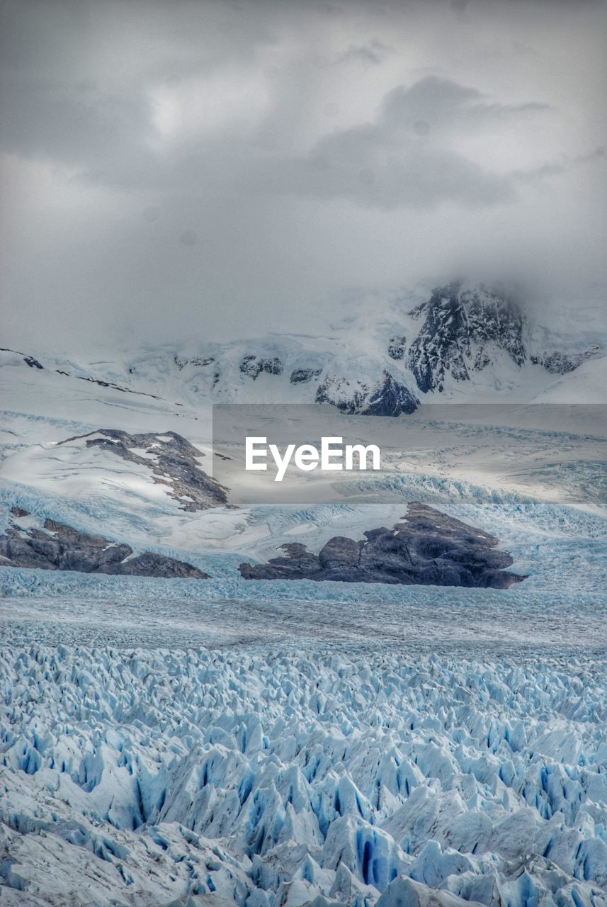 Scenic view of landscape against sky during winter