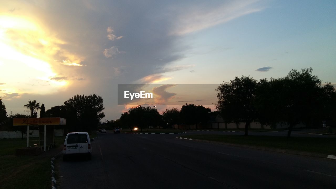 ROAD WITH TREES IN BACKGROUND