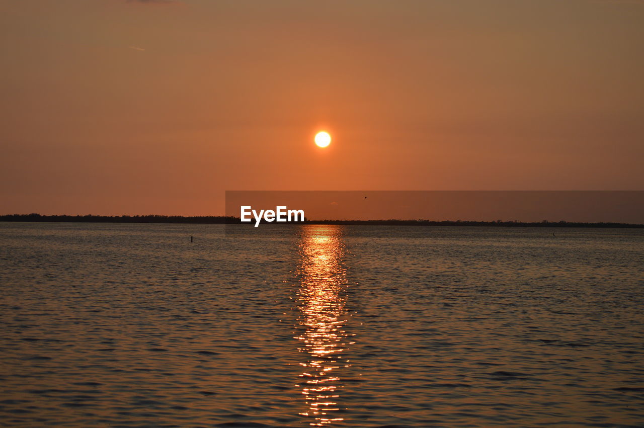 SCENIC VIEW OF SEA DURING SUNSET