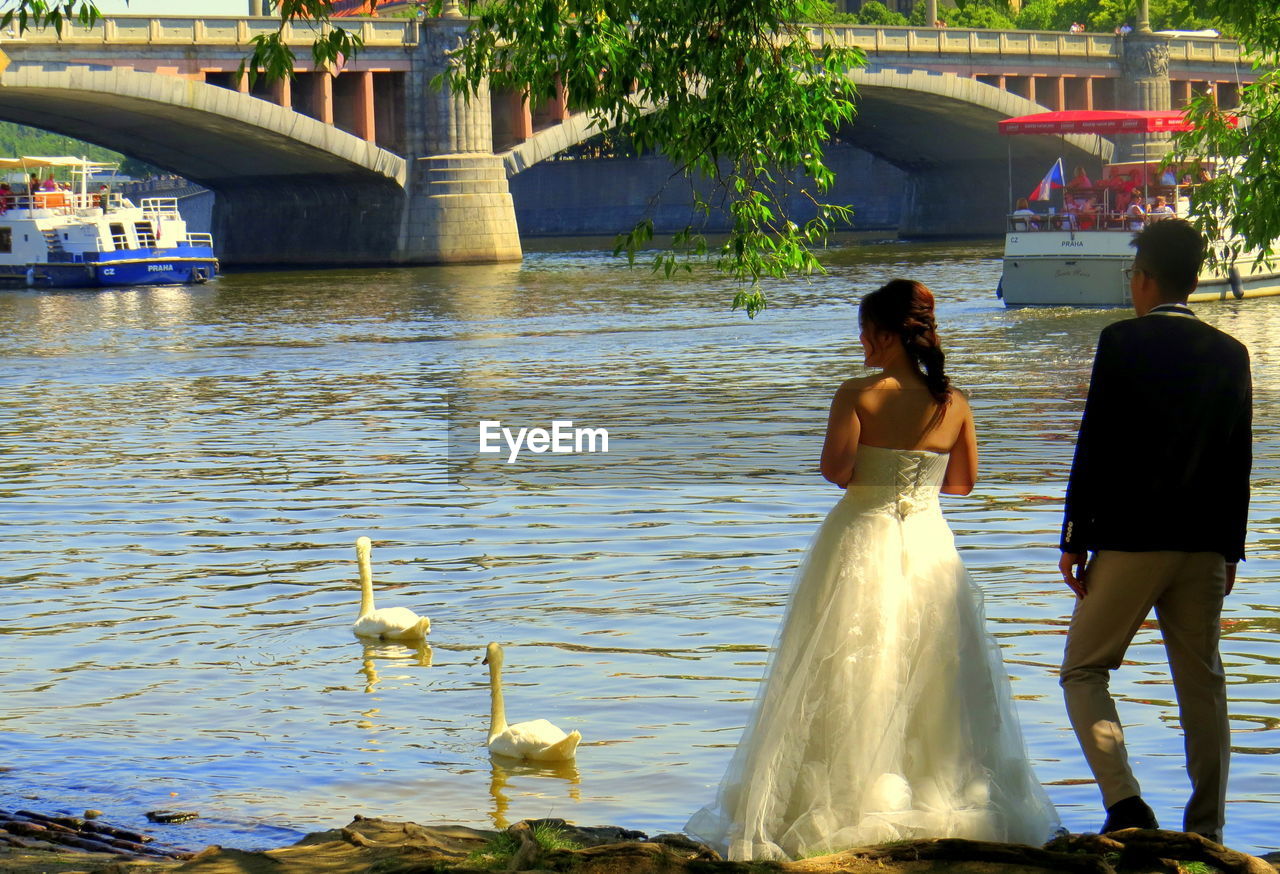 COUPLE KISSING ON BRIDGE