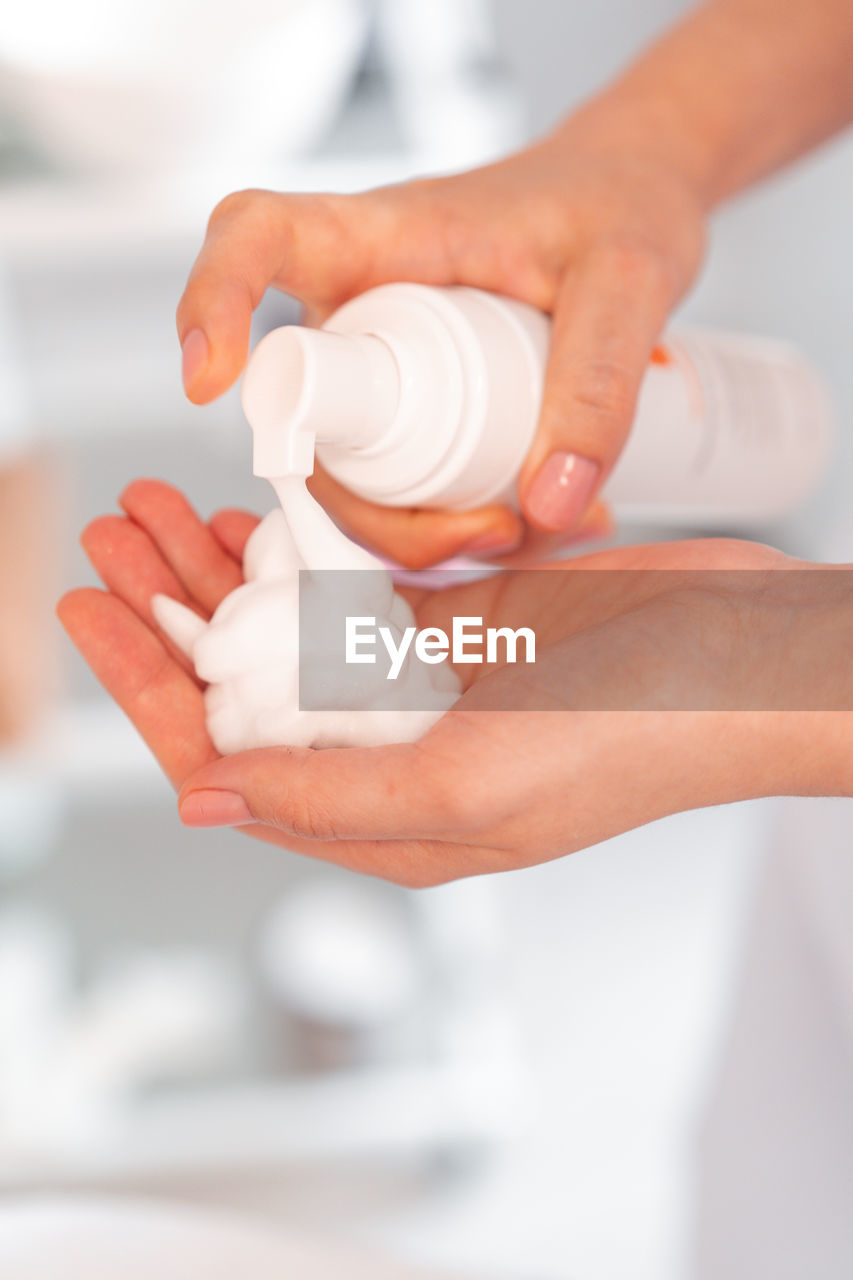 cropped hands of person washing hand