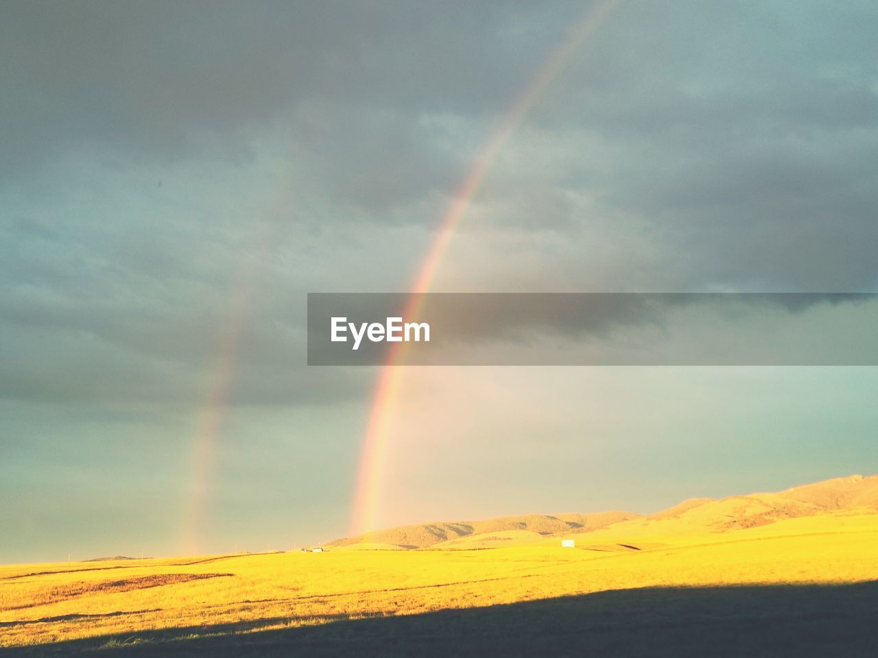 SCENIC VIEW OF RAINBOW AGAINST SKY