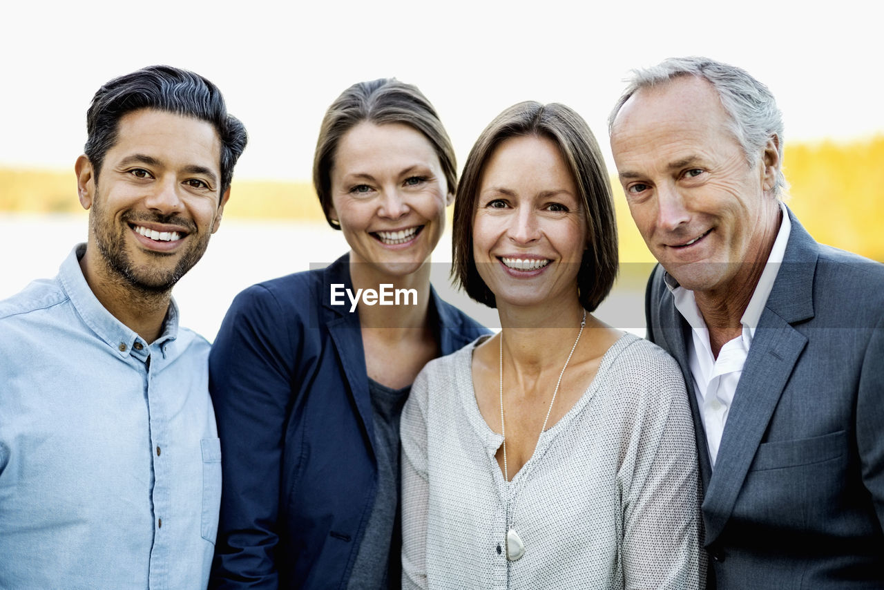 Portrait of happy business people outdoors