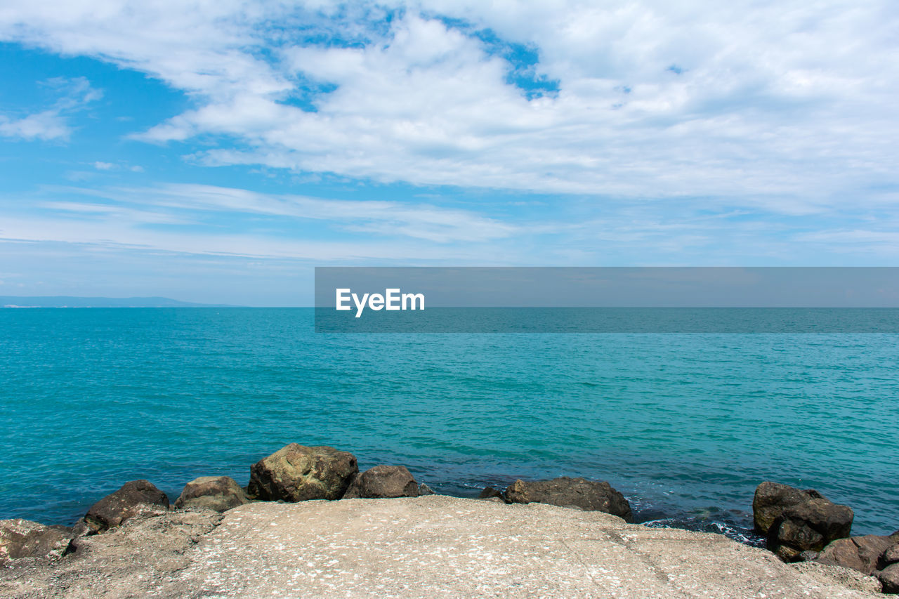 View of calm blue sea against sky