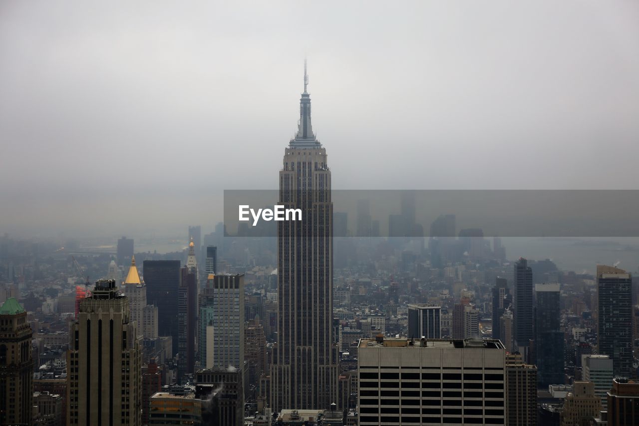 Modern buildings in city against sky