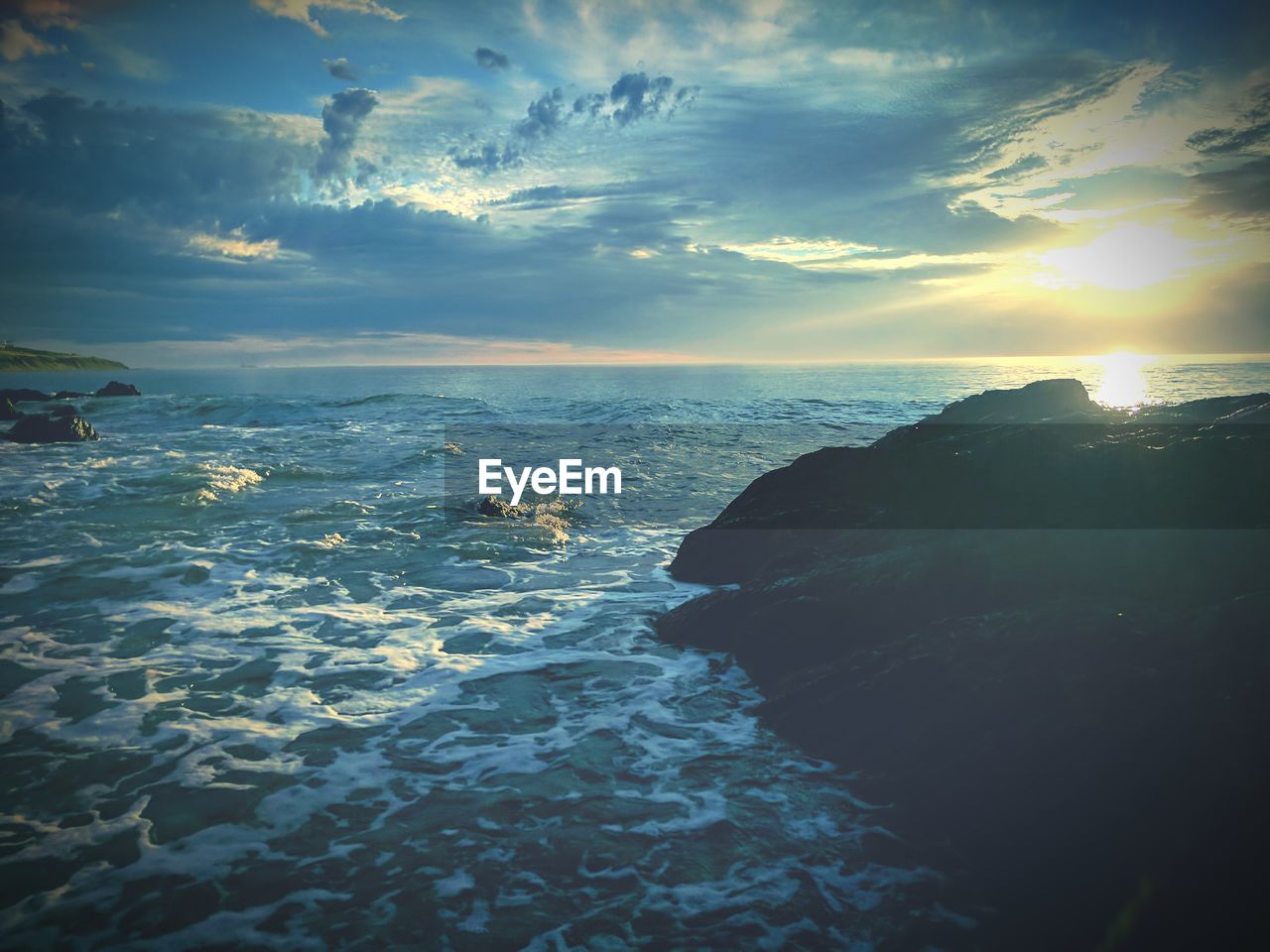 Scenic view of sea against sky during sunset