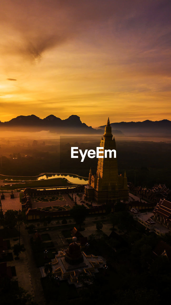 AERIAL VIEW OF CITY BUILDINGS AT SUNSET