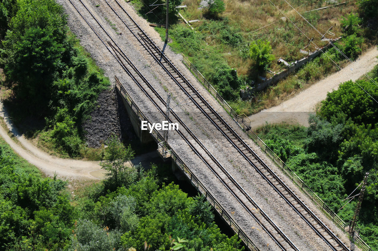 High angle view of railroad tracks over road