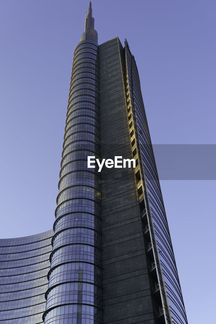 low angle view of modern building against clear blue sky