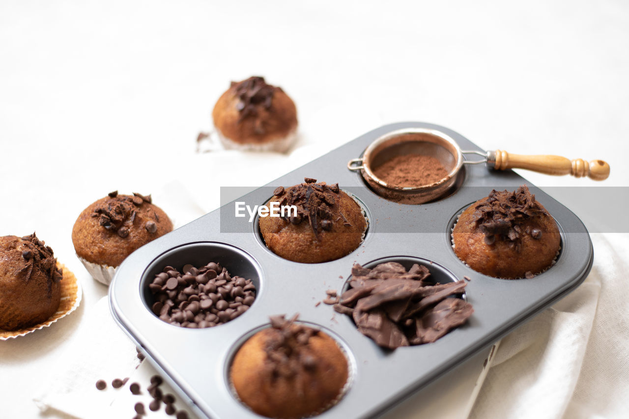 food and drink, food, chocolate, sweet food, confiture, dessert, freshness, sweet, studio shot, no people, indoors, baked, chocolate balls, fruit, still life, white background, produce, variation, temptation, edible mushroom, cake, healthy eating, brown, dried fruit