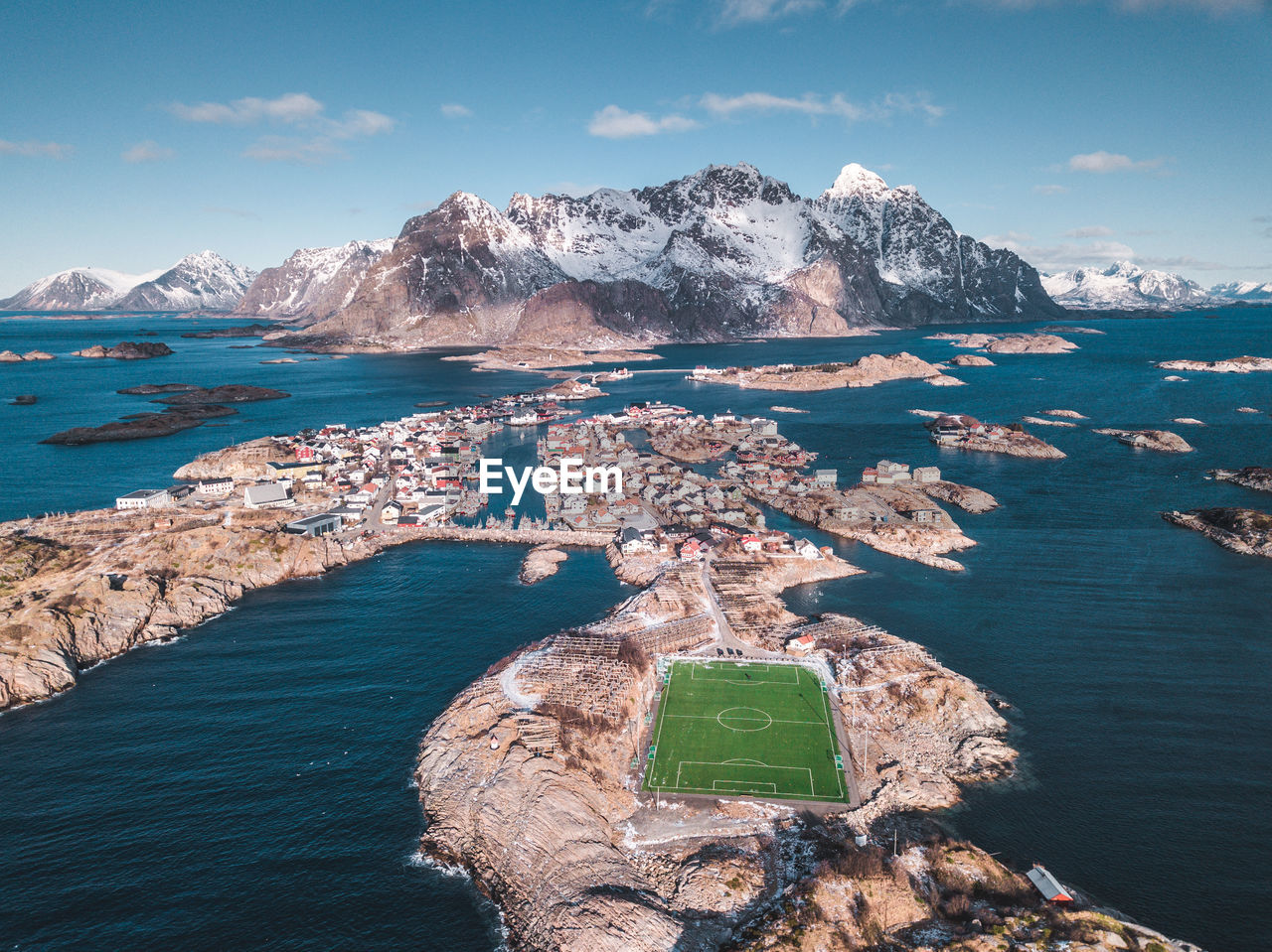 Scenic view of sea and mountains against sky