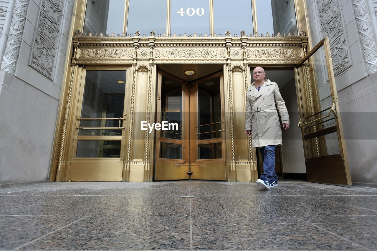 Full length of man exiting from wrigley building