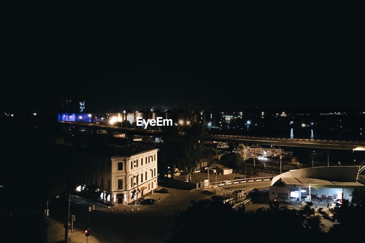 VIEW OF ILLUMINATED BUILDINGS AT NIGHT