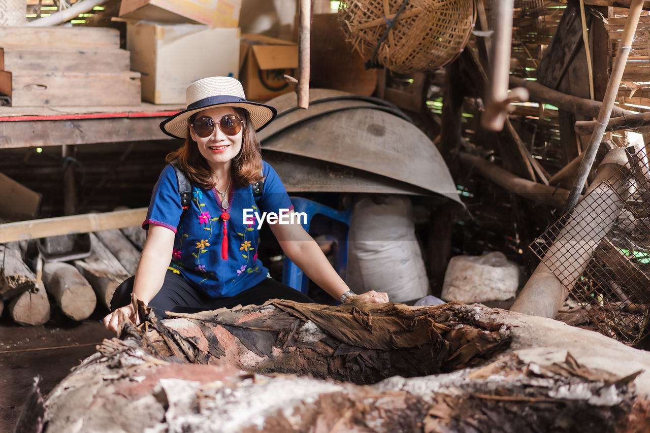 Portrait of smiling woman wearing sunglasses