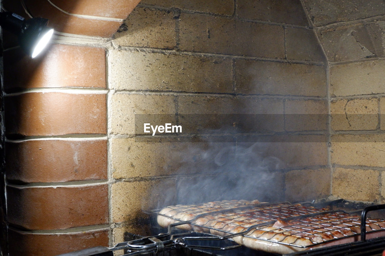 HIGH ANGLE VIEW OF MEAT ON BARBECUE