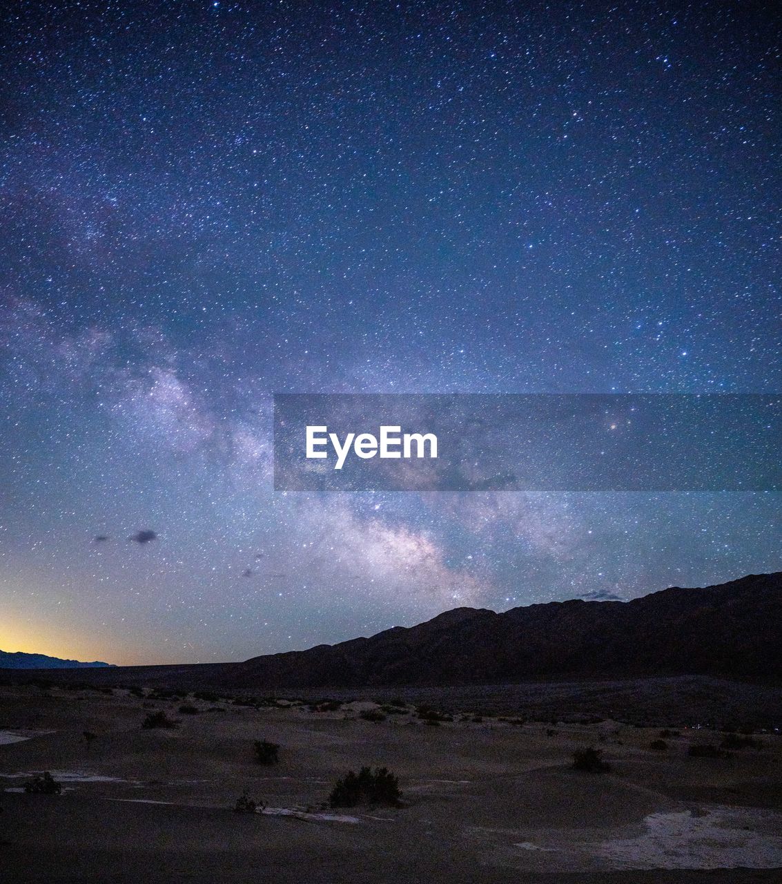 low angle view of silhouette mountain against sky at night