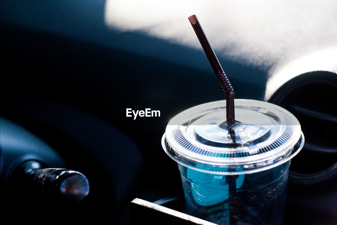 CLOSE-UP OF CIGARETTE ON TABLE WITH LIGHT