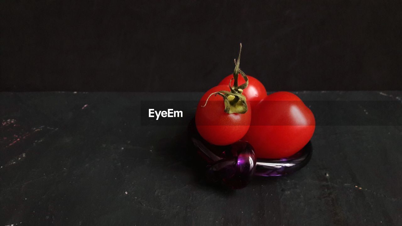 Close-up of red tomatoes on table