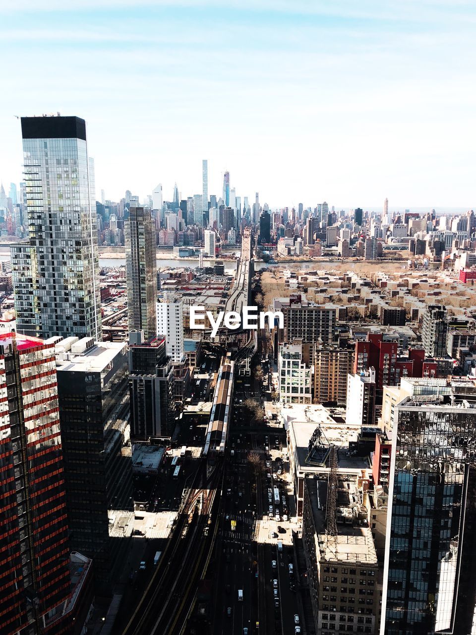 High angle view of buildings in city against sky