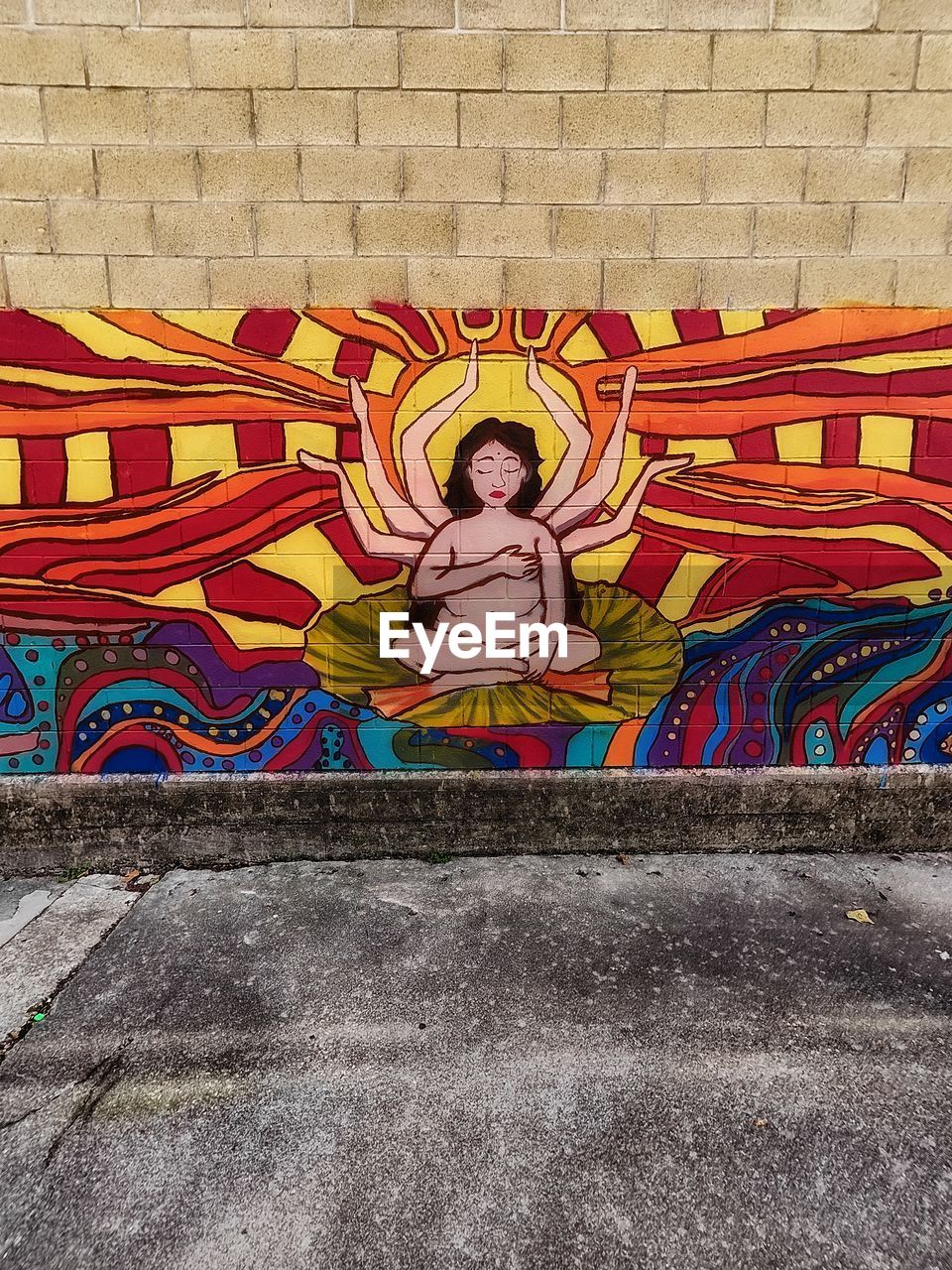 mural, creativity, wall, art, multi colored, one person, architecture, wall - building feature, graffiti, day, representation, full length, built structure, street art, painting, front view, outdoors, person, human representation, drawing, pattern, city, religion