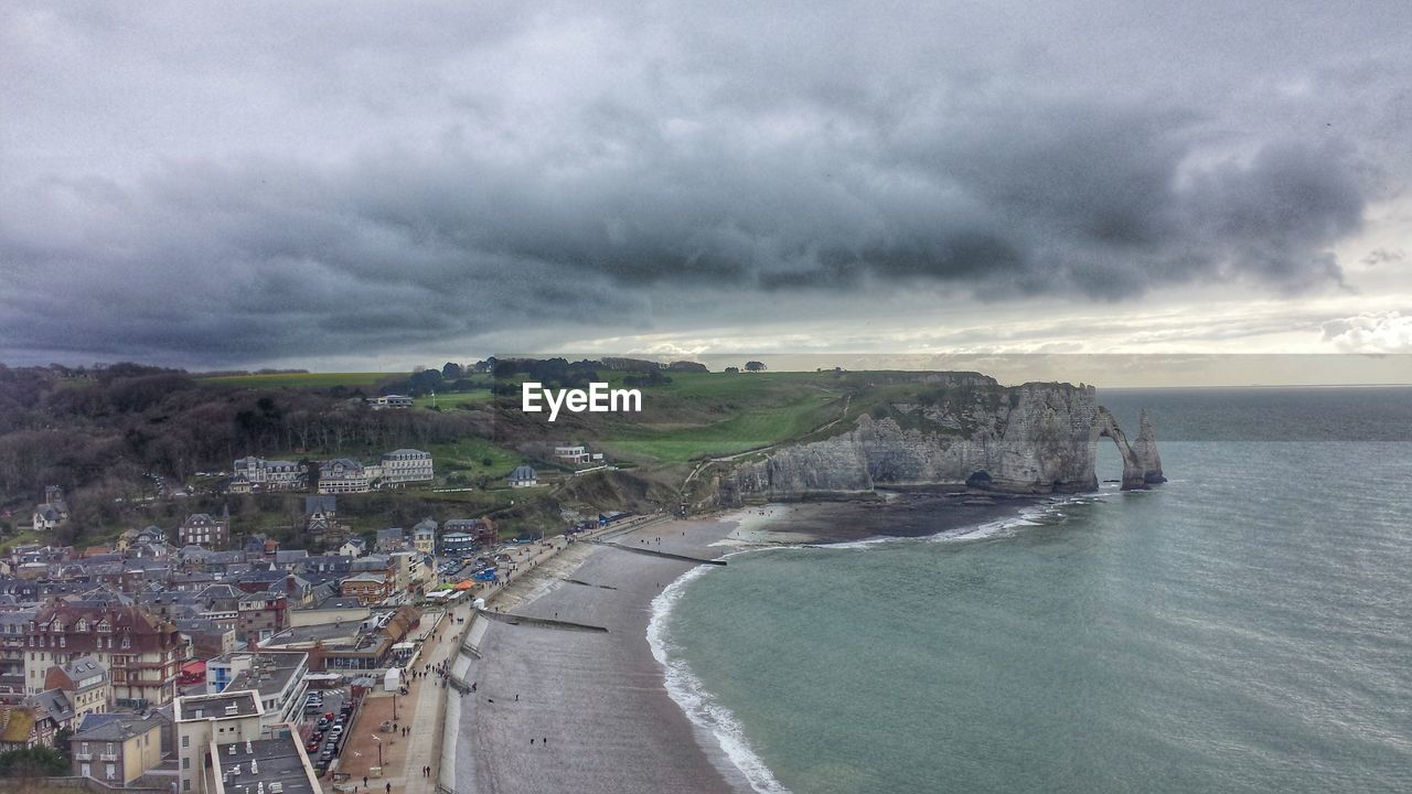 VIEW OF SEA AGAINST CLOUDY SKY