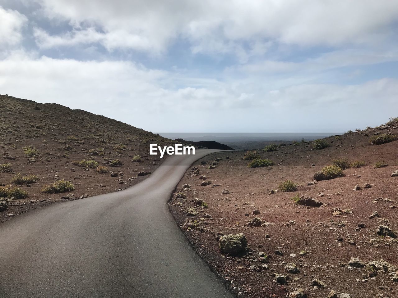 ROAD LEADING TOWARDS MOUNTAINS