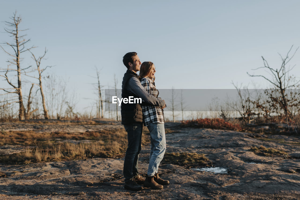 Young couple embracing during autumn hike