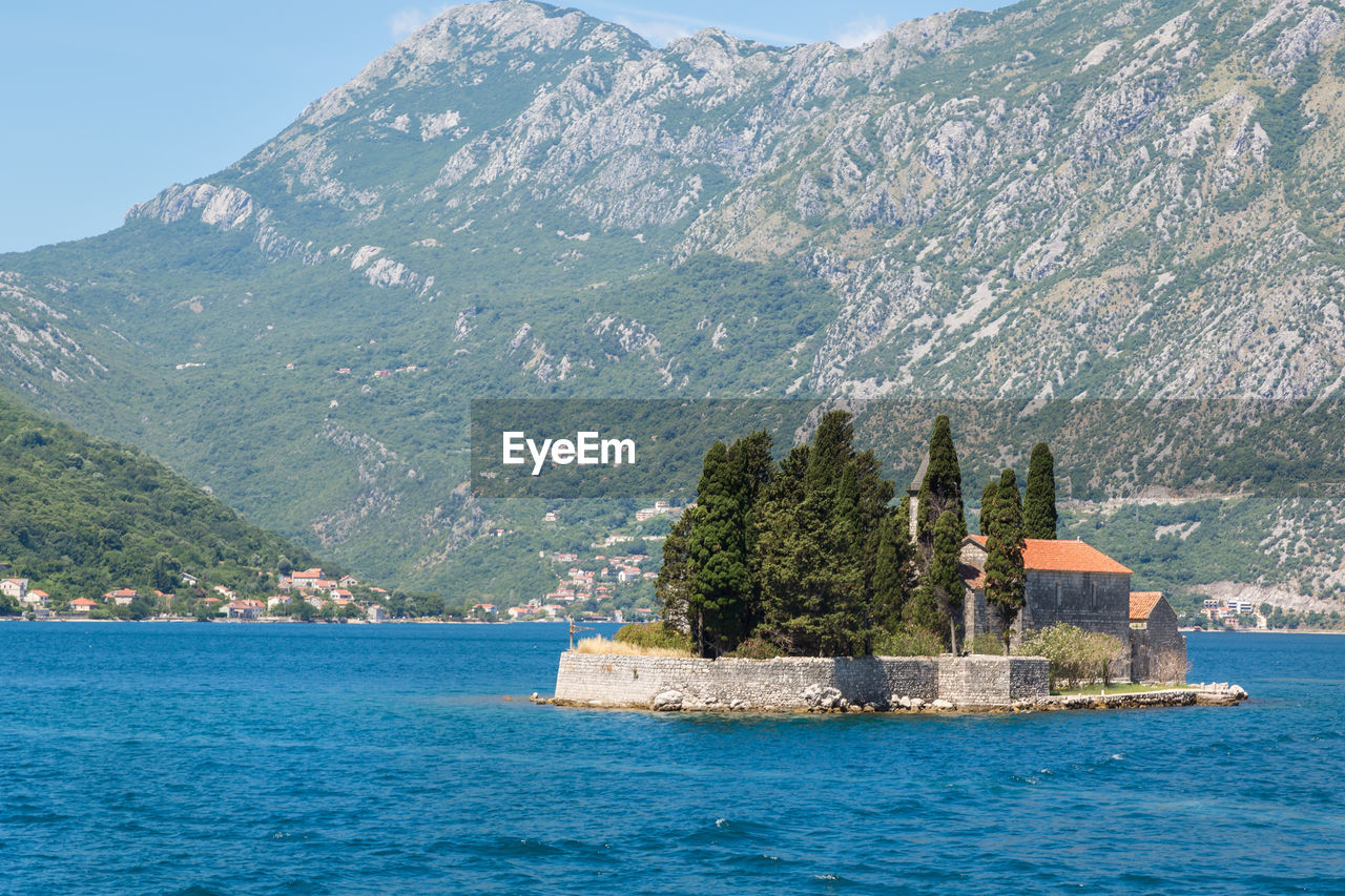 St george island with former benedictine monastery on adriatic sea by mountains