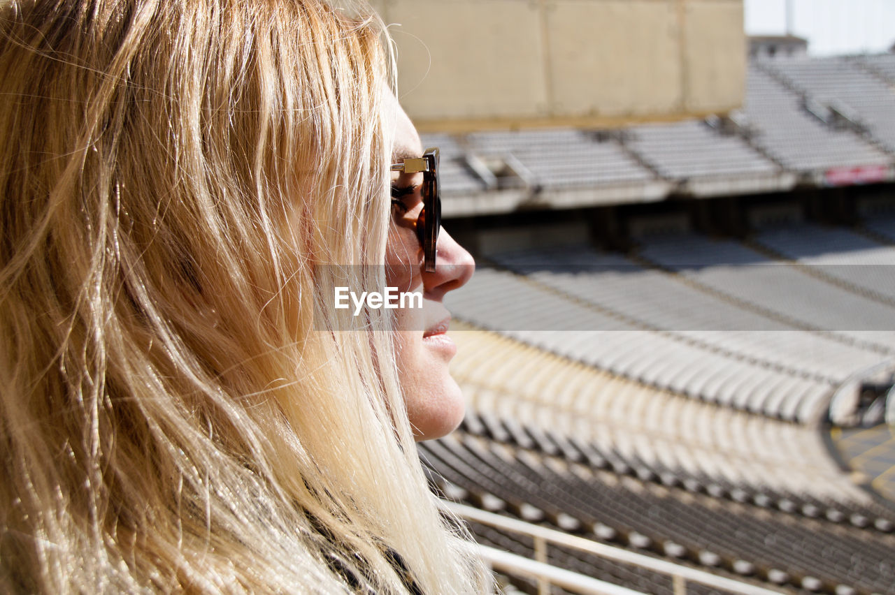 Close-up of woman in stadium