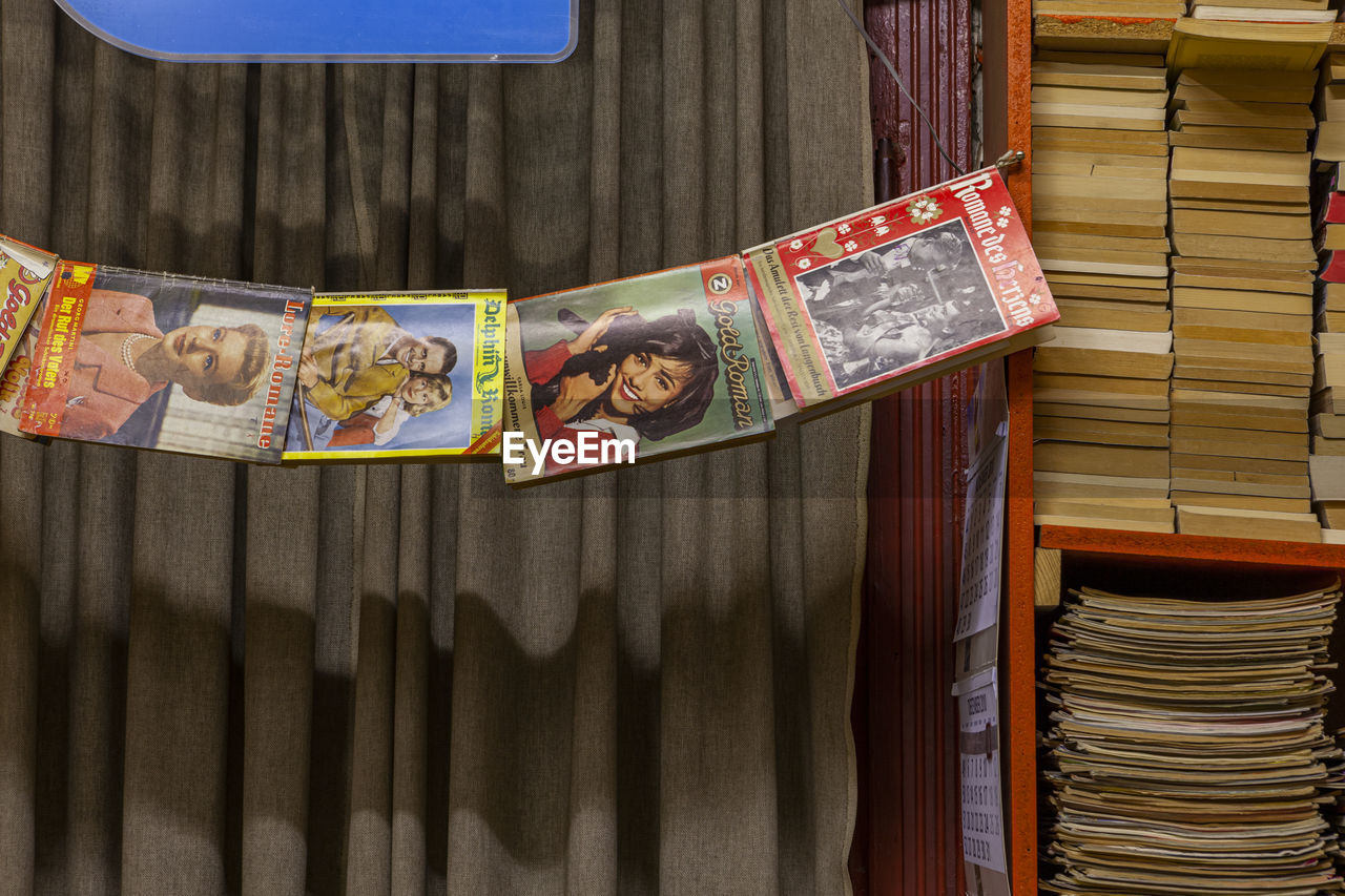 CLOSE-UP OF BOOKS ON SHELF