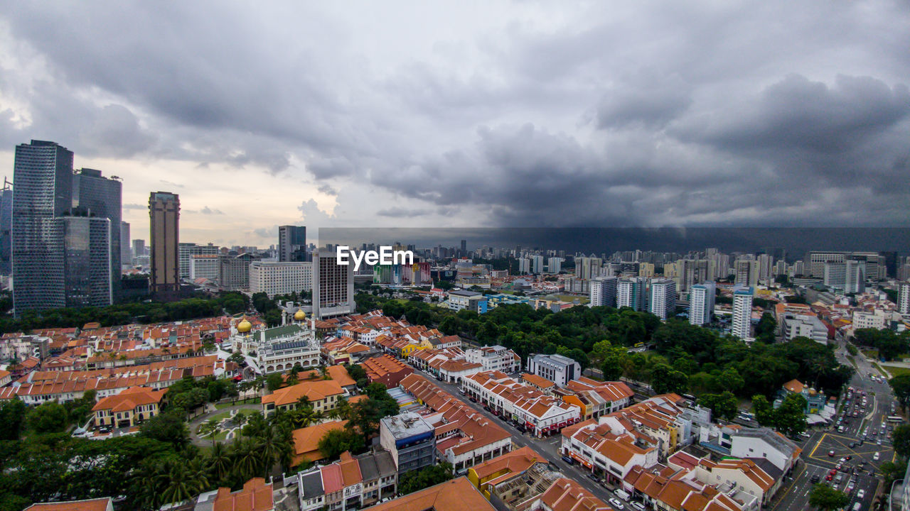 High angle view of buildings in city against sky