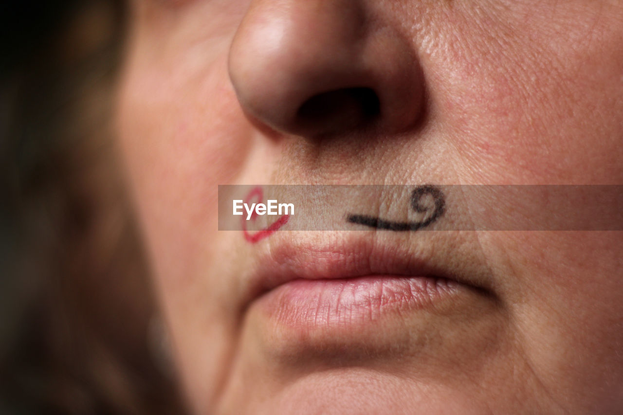 Close-up of woman with face paint