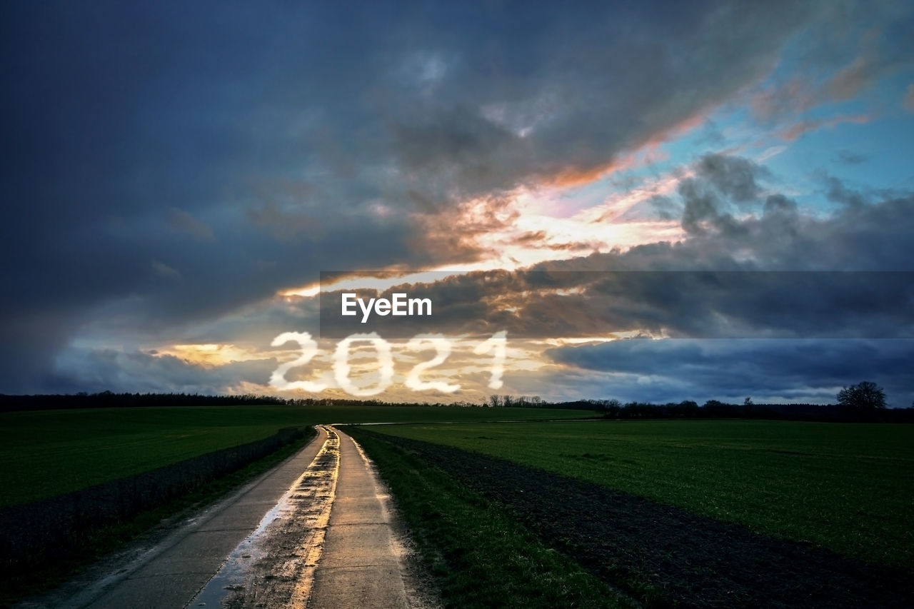 PANORAMIC VIEW OF ROAD AGAINST SKY DURING SUNSET