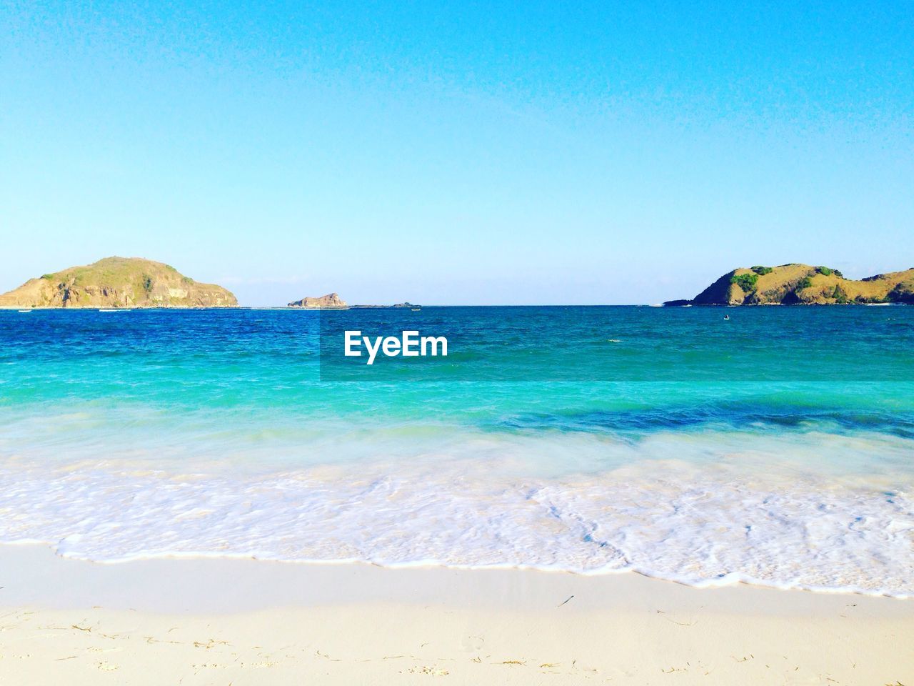 View of beach against blue sky