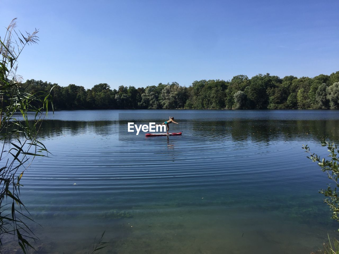 MAN ON BOAT AGAINST SKY