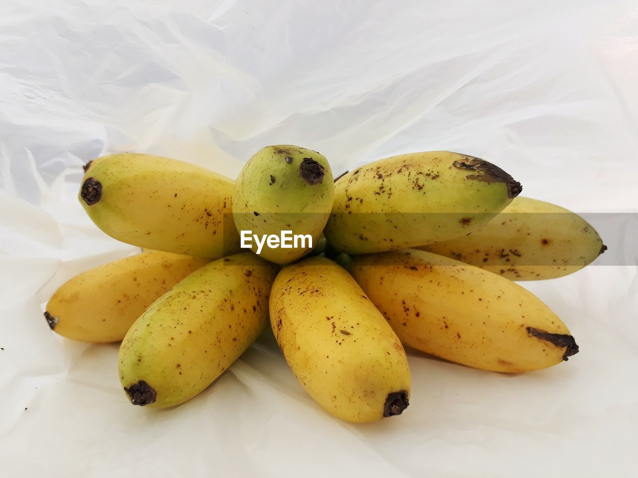 HIGH ANGLE VIEW OF YELLOW FRUITS ON TABLE