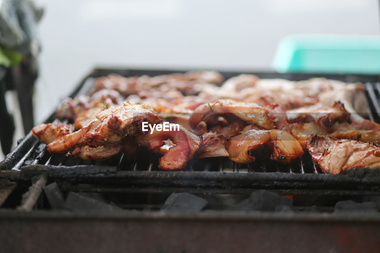 Pork pieces grilled on street charcoal grills in the street