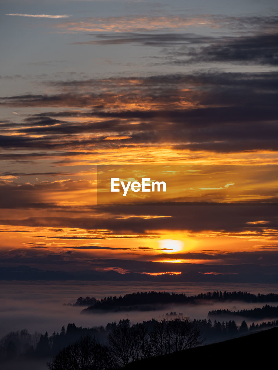 SCENIC VIEW OF DRAMATIC SKY OVER SILHOUETTE LANDSCAPE