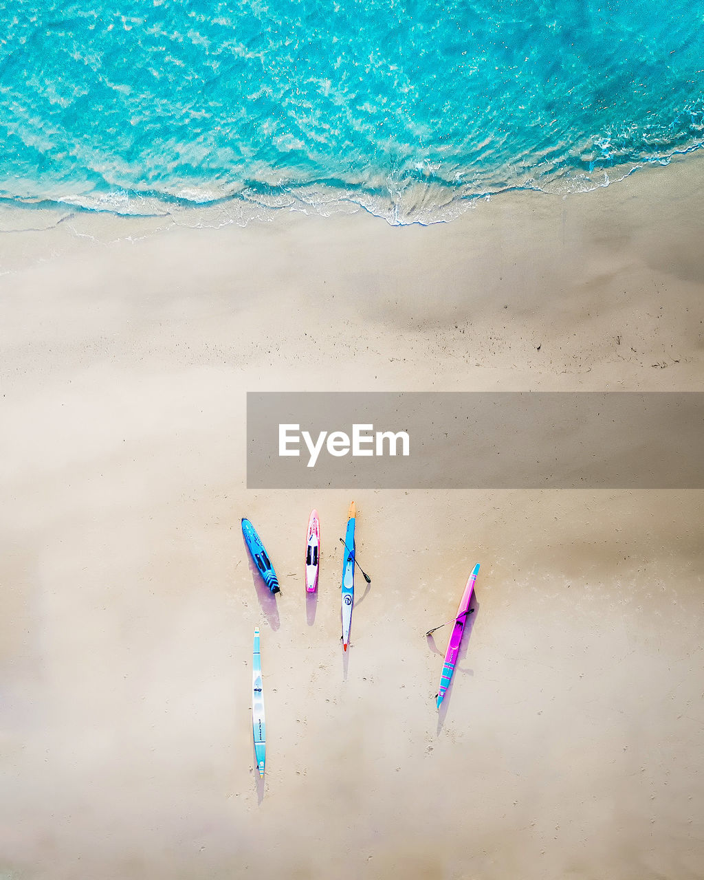 HIGH ANGLE VIEW OF WOMAN ON BEACH