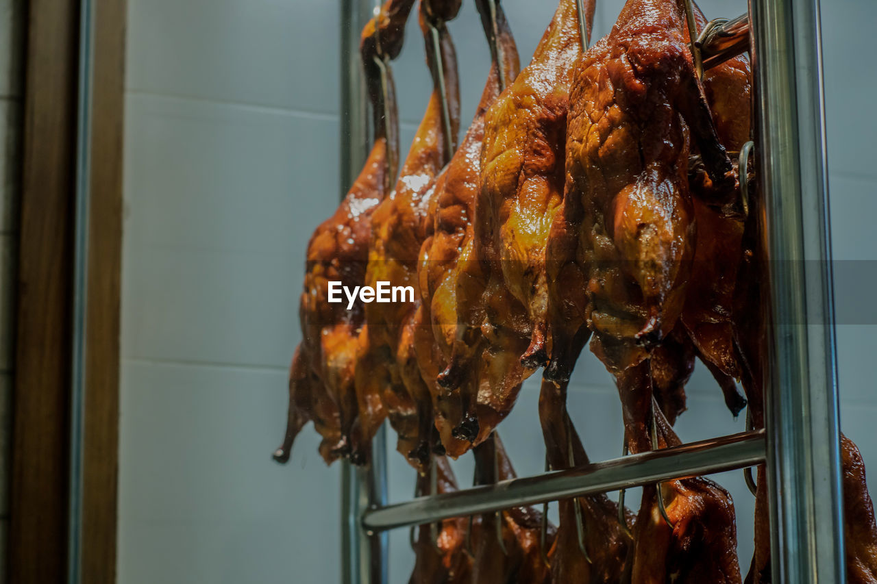 Close-up of duck meat on barbecue grill