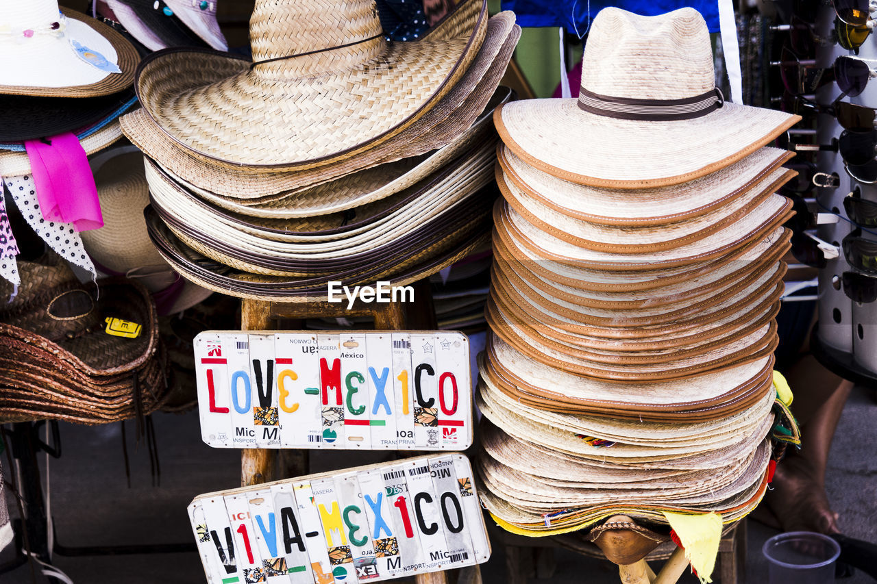 Close-up of sun hats for sale at market stall